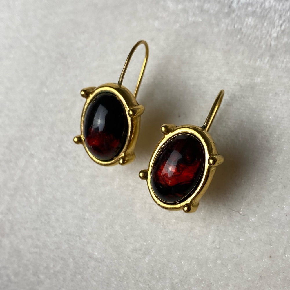 Gold earrings.